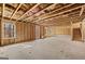 Unfinished basement with exposed framing and stairs at 2210 Cormac St, East Point, GA 30344