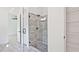 Spa-like bathroom with a large glass shower and grey tile at 2346 East Maddox Rd, Buford, GA 30518