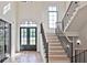 Spacious entryway with a grand staircase and natural light at 2346 East Maddox Rd, Buford, GA 30518