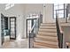 Open entryway with staircase, hardwood floors, and high ceilings at 2346 East Maddox Rd, Buford, GA 30518