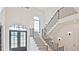 Two-story entryway with hardwood floors, and a staircase at 2346 East Maddox Rd, Buford, GA 30518