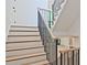 Modern staircase with black metal railings and light wood steps at 2346 East Maddox Rd, Buford, GA 30518