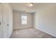 Bright bedroom with carpet flooring and a window offering natural light at 277 Tulip Dr, Covington, GA 30016