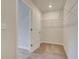 Walk-in closet with wire shelving and carpeted flooring at 277 Tulip Dr, Covington, GA 30016