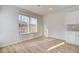 Bright dining area with hardwood floors and large windows offering natural light at 277 Tulip Dr, Covington, GA 30016