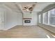 Living room with hardwood floors, fireplace, and coffered ceiling at 277 Tulip Dr, Covington, GA 30016