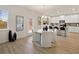 Kitchen and dining area with breakfast bar and white chairs at 2210 Cormac St, East Point, GA 30344