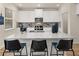 Well-equipped kitchen featuring white cabinets and a large granite island at 2210 Cormac St, East Point, GA 30344