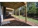 Covered backyard deck with access to a fenced yard at 6996 Fringe Flower Dr # 84, Austell, GA 30168