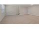 Open basement area with neutral carpeting at 6996 Fringe Flower Dr # 84, Austell, GA 30168