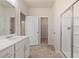 Bathroom with double vanity, tile floor and a large shower at 6996 Fringe Flower Dr # 84, Austell, GA 30168