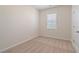 Well-lit bedroom featuring carpeted floors and window blinds at 6996 Fringe Flower Dr # 84, Austell, GA 30168