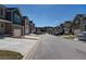 Street view showcasing townhomes with attached garages at 6996 Fringe Flower Dr # 84, Austell, GA 30168