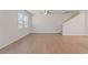 Living room with hardwood floors, a ceiling fan and stairs to the second floor at 6996 Fringe Flower Dr # 84, Austell, GA 30168