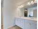 Bathroom with double vanity, mirror and light fixtures at 75 Barge Ln, Covington, GA 30016