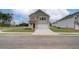 Two-story home with light brick and siding, two-car garage, and driveway at 75 Barge Ln, Covington, GA 30016