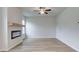 Living room features a fireplace, hardwood floors, and ceiling fan at 75 Barge Ln, Covington, GA 30016