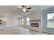 Bright living room with fireplace, hardwood floors, and large windows at 75 Barge Ln, Covington, GA 30016