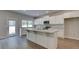 Modern kitchen with white cabinets, granite countertops, and a large island at 119 Felicity Pike, Locust Grove, GA 30248