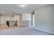 Spacious loft area with grey carpet and a railing at 119 Felicity Pike, Locust Grove, GA 30248