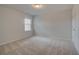 Cozy bedroom with neutral colored carpet and window at 300 Navigator Ln, Mcdonough, GA 30253