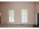 Living room with white shutters and neutral walls at 410 Raven Dr, Canton, GA 30115