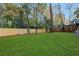 Large fenced backyard with lush green lawn at 641 Longwood Nw Dr, Atlanta, GA 30305