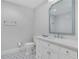 Basement bathroom with white vanity and patterned floor at 641 Longwood Nw Dr, Atlanta, GA 30305