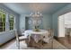 Elegant dining room with light blue walls and chandelier at 641 Longwood Nw Dr, Atlanta, GA 30305