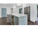 Modern kitchen with white cabinets, stainless steel appliances and blue island at 641 Longwood Nw Dr, Atlanta, GA 30305