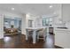 Open concept kitchen with island seating and views into dining area at 641 Longwood Nw Dr, Atlanta, GA 30305