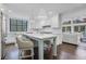 Modern kitchen with white cabinets, a light blue island, and stainless steel appliances at 641 Longwood Nw Dr, Atlanta, GA 30305