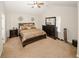 Bright bedroom featuring a king-size bed and ample closet space at 208 Magnaview Dr, Mcdonough, GA 30253