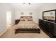 Serene bedroom with king-size bed and neutral decor at 208 Magnaview Dr, Mcdonough, GA 30253