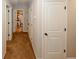 Light and bright hallway with carpet flooring and access to bedrooms and bathroom at 208 Magnaview Dr, Mcdonough, GA 30253