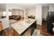 Kitchen island with granite counters and a view into the living room at 208 Magnaview Dr, Mcdonough, GA 30253