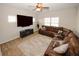 Relaxing living room featuring a sectional sofa and large TV at 208 Magnaview Dr, Mcdonough, GA 30253