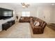 Relaxing living room features a large sectional sofa and TV at 208 Magnaview Dr, Mcdonough, GA 30253