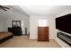 Main bedroom with a dresser, TV and electric fireplace at 208 Magnaview Dr, Mcdonough, GA 30253