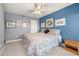 King bedroom with blue and gray walls and ceiling fan at 2827 Overlook Ne Trce, Atlanta, GA 30324