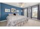 King bedroom with blue walls, ceiling fan and ample natural light at 2827 Overlook Ne Trce, Atlanta, GA 30324