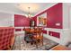 Formal dining room with hardwood floors and a red accent wall at 2827 Overlook Ne Trce, Atlanta, GA 30324