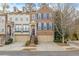 Brick front townhouse with 2-car garage, steps, and landscaping at 2827 Overlook Ne Trce, Atlanta, GA 30324