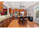 Well-lit kitchen with stainless steel appliances, granite countertops, and an island with bar stools at 2827 Overlook Ne Trce, Atlanta, GA 30324