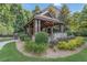 Landscaped backyard featuring manicured lawn, mulch beds, shrubs and covered outdoor pavillion at 2827 Overlook Ne Trce, Atlanta, GA 30324