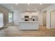 Modern white kitchen with stainless steel appliances and a large island at 328 Navigator Ln, Mcdonough, GA 30253