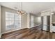 Bright dining room with hardwood floors and large window at 341 Harris Ave, Locust Grove, GA 30248