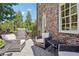 Relaxing deck with wicker chairs and a grill for outdoor entertaining at 475 Rose Garden Ln, Alpharetta, GA 30009