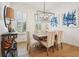 Bright dining room featuring hardwood floors and stylish light fixture at 475 Rose Garden Ln, Alpharetta, GA 30009