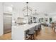 Modern kitchen with large island, stainless steel appliances, and white cabinetry at 475 Rose Garden Ln, Alpharetta, GA 30009